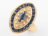 a close up of a gold ring with blue and white stones