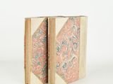 pair of antique bookends with pink, blue and green designs