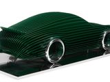 a cake shaped like a car on a white plate