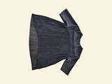 black pleated dress with a bow on a white background