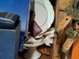 a blue box with a white plate in it and a blue box with a white plate in it and a blue box with a white plate in it