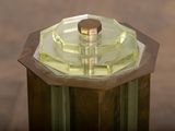 a close up of a glass vase on a wooden table