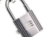 a metal padlock with a wooden handle on a white background