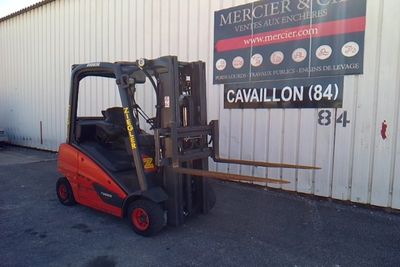 a forklift parked in front of a building