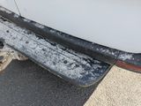 a close up of a car ' s bumper with snow on it