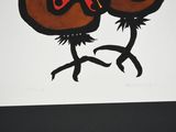 two birds that are sitting on top of each other