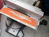 a table saw sitting on top of a table in a store