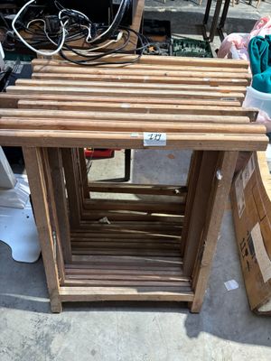 a wooden table with a lot of boxes on the ground