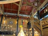 a large light bulb hanging from the ceiling of a building
