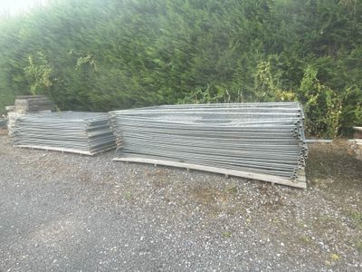 a pile of steel bars stacked on top of each other