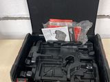 a black tool case with tools in it on a table