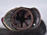 a helmet on top of a long black hair