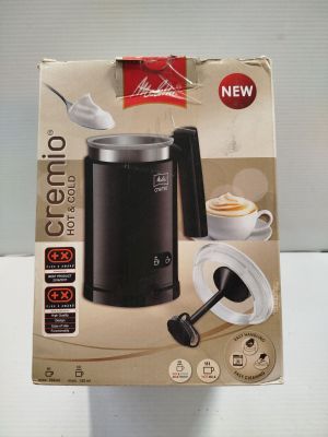 la boîte d'une cafetière contenant une cuillère