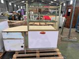 a counter that is sitting on a pallet in a warehouse