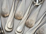 a lot of silver spoons and spoon spoons on a table