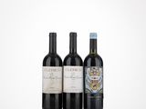 three bottles of wine sitting on top of a table next to each other