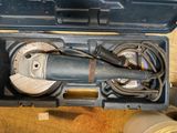 a tool in the case that is open on the floor