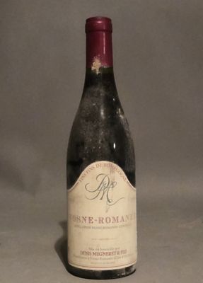 a bottle of wine that is sitting on a table
