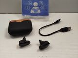 a pair of ear buds sitting on a table next to a box