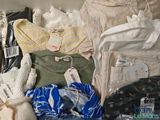 a pile of clothing that is sitting on top of a table