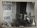 a black and white photo of a group of people on stage