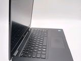 a laptop that is open on a white surface