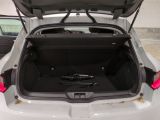 a trunk of a white car with its doors open