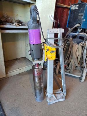 a machine that is sitting in a room with a lot of tools