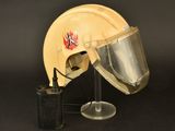 a helmet and a radio sitting on a table