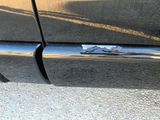 a close up of a car ' s door handle and door handle
