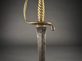 a gold and silver sword on a black background