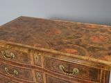 a chest of drawers with many drawers on top of it