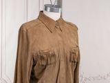 an image of a brown shirt with fringes on a mannequin mannequin