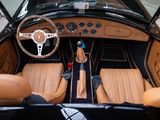 a view of the interior of a car from the driver ' s seat