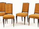 four chairs with upholstered backrests and wooden legs