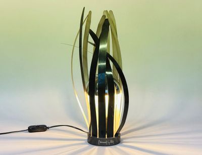 a lamp that is sitting on a table with a cord