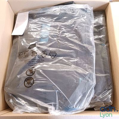 a box with a shirt in it that is wrapped in plastic