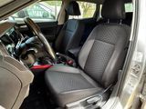 the interior of a car with two black seats and a steering wheel