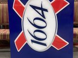 blue and red sign with a white and red xo logo on it
