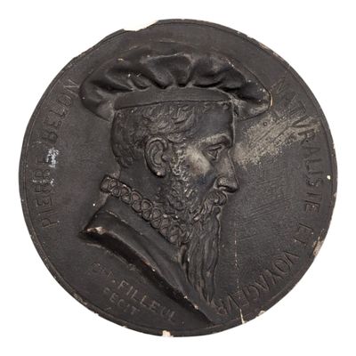 an old coin with a man wearing a hat on it