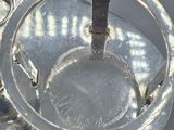 a silver plate with a spoon and a spoon rest on it