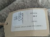 a label on a stuffed animal that is on a table