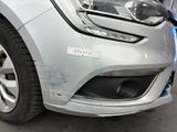 a close up of a car with a denting on the front of it