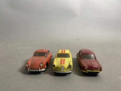 three toy cars that are sitting next to each other
