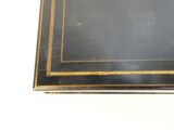 a black table with a gold border on it