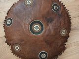 a large brown leather object on the floor