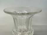 a clear glass vase with a decorative design on it