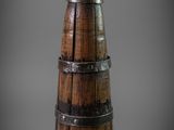 an image of a wooden wine bottle with a metal band around it