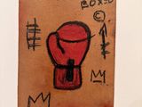 a drawing of a red boxing glove on a piece of paper