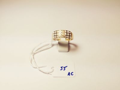 a close up of a gold ring on a string with a price tag